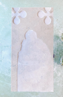 Marble slab with the main relief area roughly carved and partially unfinished