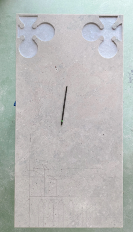 Uncarved marble slab with preliminary markings for the relief design